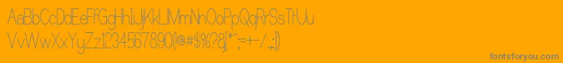 CastorgateUpright-Schriftart – Graue Schriften auf orangefarbenem Hintergrund