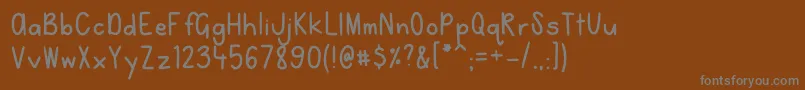 Czcionka NoahandNicole – szare czcionki na brązowym tle