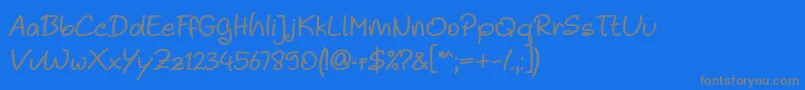 フォントNoela Sherly Regular – 青い背景に灰色の文字