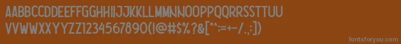 Шрифт Nootdorp Regular Demo – серые шрифты на коричневом фоне