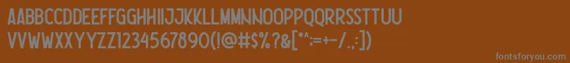 Nootdorp Regular Demo Font – Gray Fonts on Brown Background