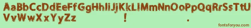 Шрифт NORIKEE DEMO – коричневые шрифты на зелёном фоне