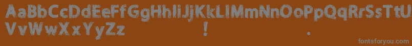 Шрифт NORIKEE DEMO – серые шрифты на коричневом фоне