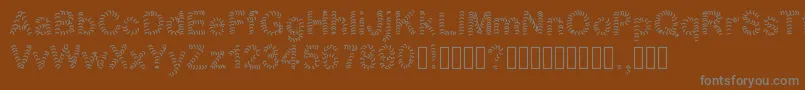 Fonte Numero1 – fontes cinzas em um fundo marrom