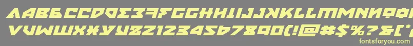 フォントnyetexpandital – 黄色のフォント、灰色の背景