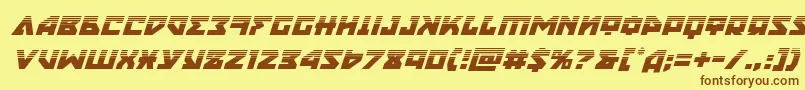 フォントnyethalfital – 茶色の文字が黄色の背景にあります。