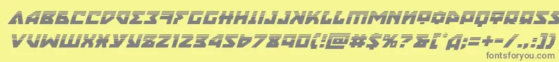 フォントnyethalfital – 黄色の背景に灰色の文字