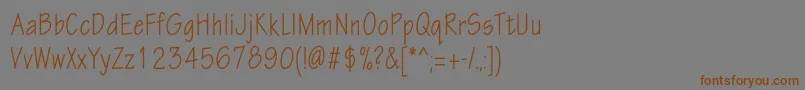 Шрифт Eskiztwocondc – коричневые шрифты на сером фоне
