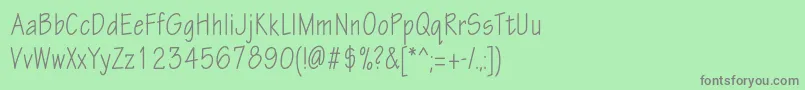 フォントEskiztwocondc – 緑の背景に灰色の文字