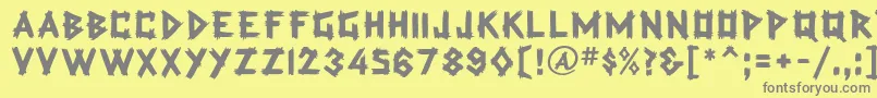 TradingPostBold-Schriftart – Graue Schriften auf gelbem Hintergrund
