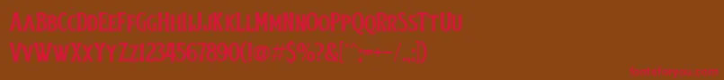 フォントObsypac – 赤い文字が茶色の背景にあります。