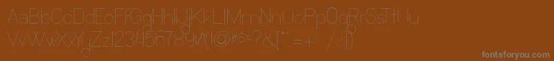 Weitere Informationen zur Ocho Siete-Schriftart Ocho Siete-Schriftart – Graue Schriften auf braunem Hintergrund