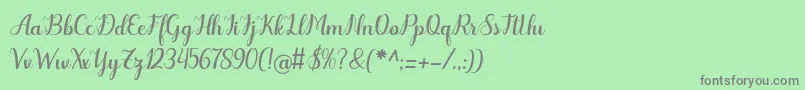 フォントOdelette – 緑の背景に灰色の文字