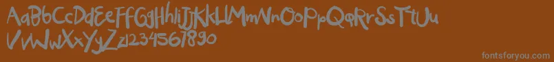 OGYIGO-Schriftart – Graue Schriften auf braunem Hintergrund