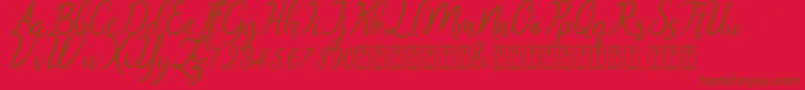Oklahoma script demo-Schriftart – Braune Schriften auf rotem Hintergrund