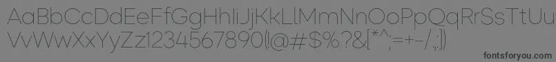 フォントOkta ExtraLight – 黒い文字の灰色の背景