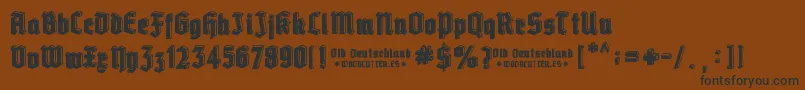 Old Deutschland-Schriftart – Schwarze Schriften auf braunem Hintergrund