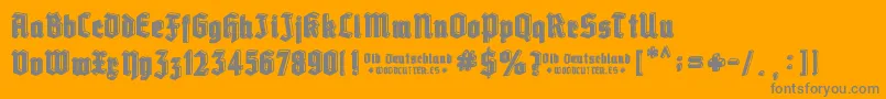 Old Deutschland-Schriftart – Graue Schriften auf orangefarbenem Hintergrund