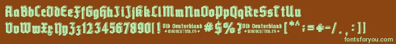 フォントOld Deutschland – 緑色の文字が茶色の背景にあります。