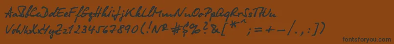 フォントOlga – 黒い文字が茶色の背景にあります