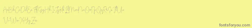 フォントOlivia Demo – 黄色の背景に灰色の文字