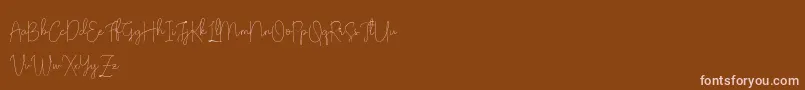 フォントOlivia Demo – 茶色の背景にピンクのフォント