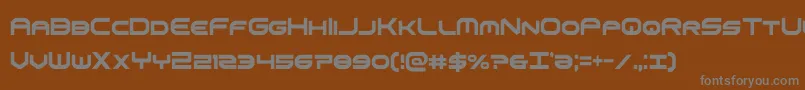 omniboyxtracond-fontti – harmaat kirjasimet ruskealla taustalla