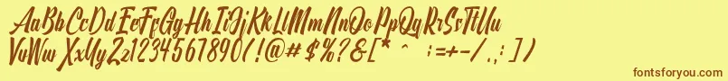 フォントOnthel – 茶色の文字が黄色の背景にあります。