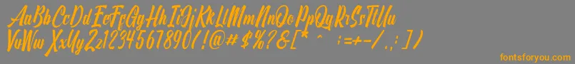 フォントOnthel – オレンジの文字は灰色の背景にあります。