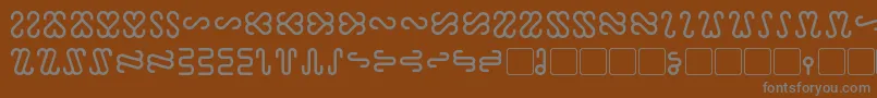 フォントOphidian – 茶色の背景に灰色の文字