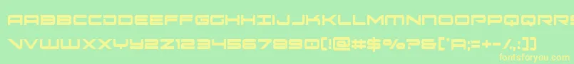 フォントoramacxtracond – 黄色の文字が緑の背景にあります