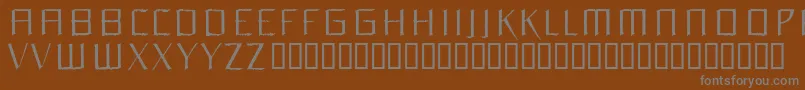 ORCHL   -fontti – harmaat kirjasimet ruskealla taustalla