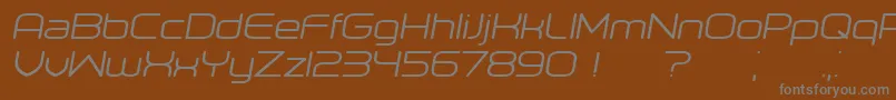 Orenburg Italic-fontti – harmaat kirjasimet ruskealla taustalla