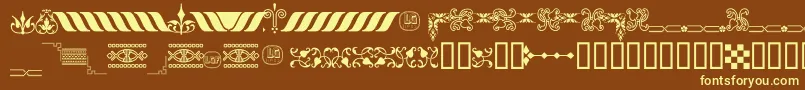 OrnamentosOrlasyVinetasLGt-fontti – keltaiset fontit ruskealla taustalla