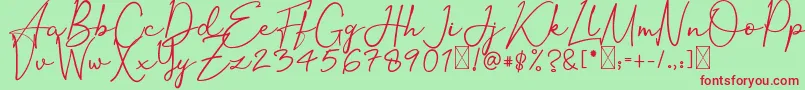 OrtisanSignature-Schriftart – Rote Schriften auf grünem Hintergrund