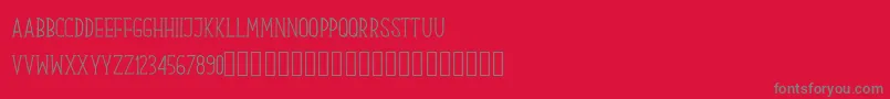 Czcionka Our Serif Hand – szare czcionki na czerwonym tle