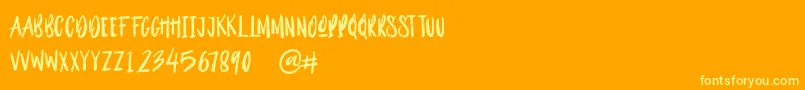 Outistyle Brush Font – Yellow Fonts on Orange Background