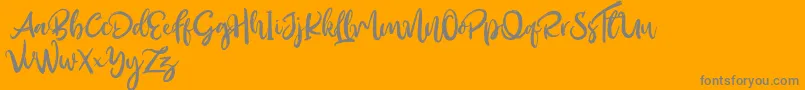 Outistyle Free-Schriftart – Graue Schriften auf orangefarbenem Hintergrund