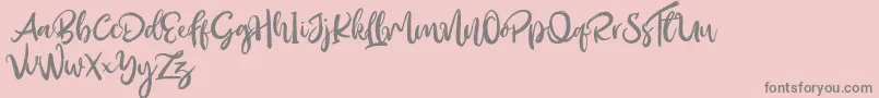 Outistyle Free-Schriftart – Graue Schriften auf rosa Hintergrund