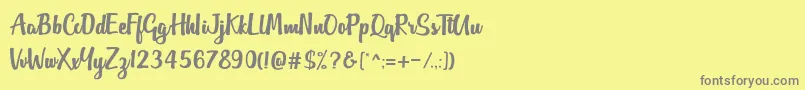フォントOutlander DF – 黄色の背景に灰色の文字