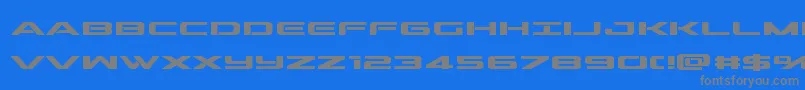 フォントoutriderbold – 青い背景に灰色の文字