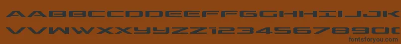 outriderexpand-Schriftart – Schwarze Schriften auf braunem Hintergrund