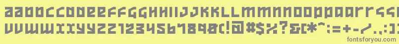 ov  -fontti – harmaat kirjasimet keltaisella taustalla