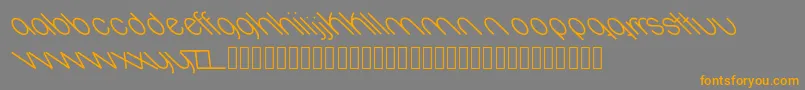 フォントOval – オレンジの文字は灰色の背景にあります。