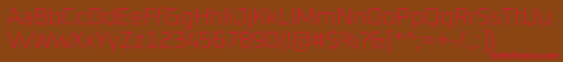 フォントOxanium ExtraLight – 赤い文字が茶色の背景にあります。