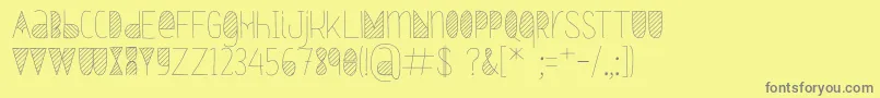 Oxymorons-fontti – harmaat kirjasimet keltaisella taustalla