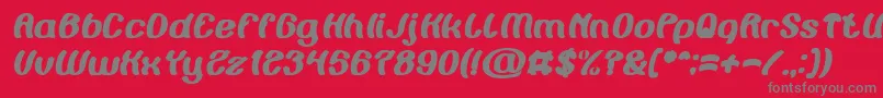 Painting the Light Bold Italic-fontti – harmaat kirjasimet punaisella taustalla