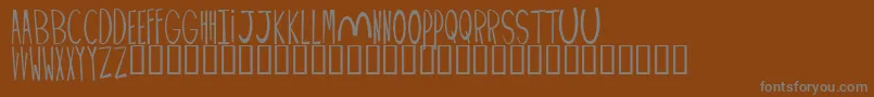 Weitere Informationen zur PALIMPUS-Schriftart PALIMPUS-Schriftart – Graue Schriften auf braunem Hintergrund