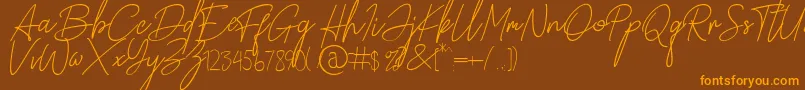 Paradise in Bali Signature Font – Orange Fonts on Brown Background