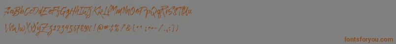 フォントParadise Typeface Free Demo – 茶色の文字が灰色の背景にあります。